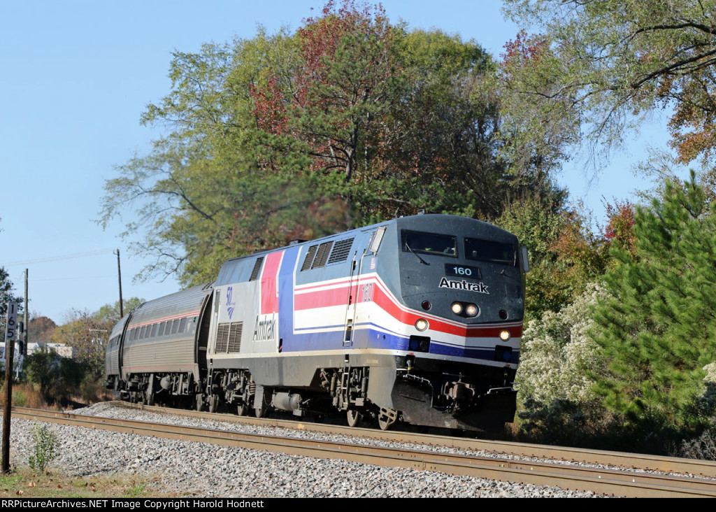 AMTK 160 leads train P080-17 away from the station